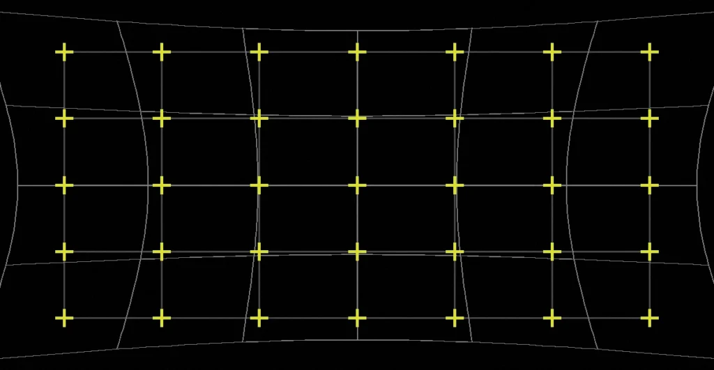 Diagram of a distorted scan field being corrected onto a true reference grid